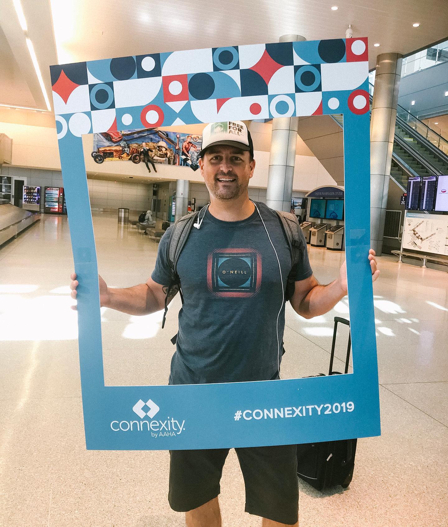 GeniusVets Chief Strategist David Hall posing with a Connexity photo frame