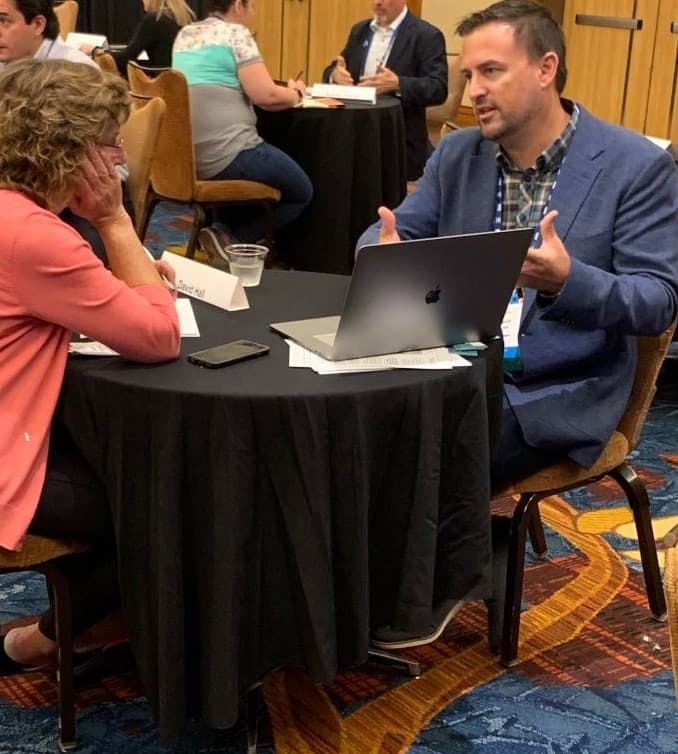 GeniusVets Chief Strategist David Hall consulting with a conference attendee during the Human Library